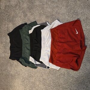 4 pairs of nike women shorts and 1 old navy shorts size small